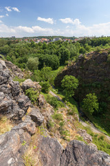 Fototapeta na wymiar Steep and rugged gorge viewed from the top at the Divoka Sarka. It's a nature reserve on the outskirts of Prague in Czech Republic.