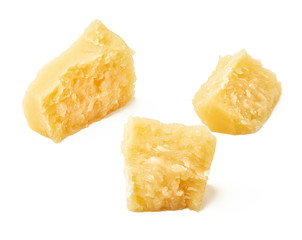 Pieces of Parmesan cheese on white background. Top view.