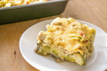 Zucchini casserole. Dietary, low-calorie fitness food. Home Casserole from courgettes with chicken and cheese, homemade food