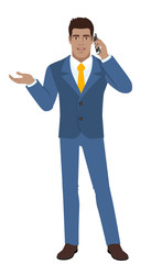 Businessman gesturing. Businessman talking on the mobile phone