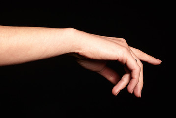 Female gesture hand isolated on black background