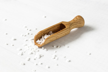 salt crystals on wooden spoon