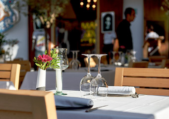 Empty wine glasses on a table at outdoors restaurant