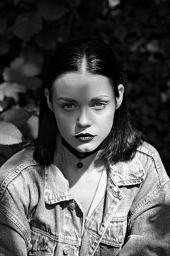 Fashion portrait of young woman wearing denim jacket