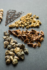 Various seeds on the black background. Selective focus.
