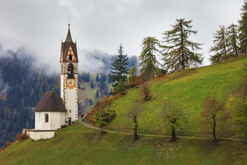 Fototapeta premium Romantic church in fog, La Valle - Wengen