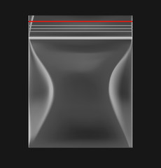 Transparent sealed plastic bag on black background