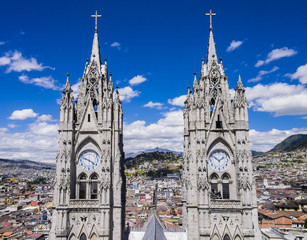 Fototapeta na wymiar Stunning view of twin clock tower of the Basilica del Voto Nacional, Quito, Ecuador 
