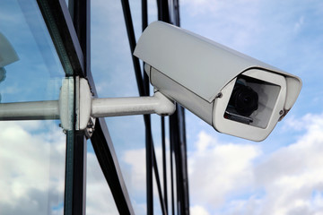 Digital CCTV camera on the glass facade