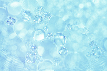 Abstract liquid bokeh or glitter lights  blue  background. Circles and defocused particles. Design template