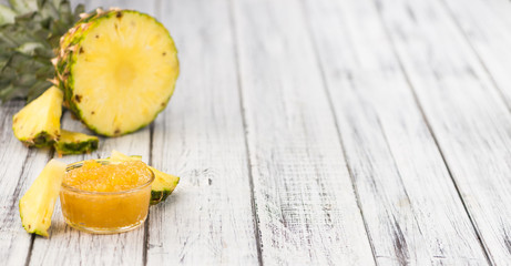 Pineapple Jam on vintage wooden background