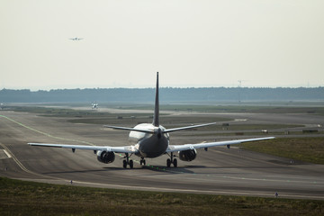 Fototapeta na wymiar Airplane on the runway
