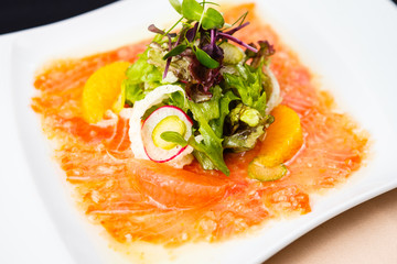 Trout carpaccio with salad