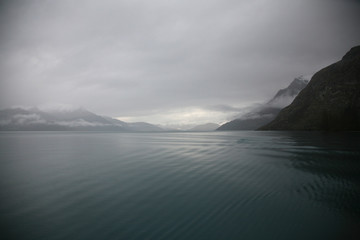 Fototapeta na wymiar Still and serene grey winter morning on Lake Wakatipu, New Zealand