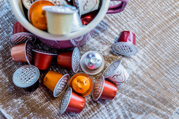 Coffe pods in enamel mug