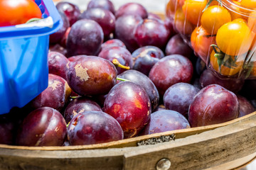 Fresh plums in a basket