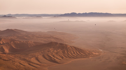 hot air balloons over the desert dunes, Sossusvlei, Namibia