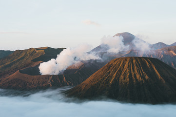 View of Mts. Bromo, Semeru, Batok and Widodaren and sea of clouds at the sunrise time in Bromo Tengger Semeru National Park, East Java, Indonesia