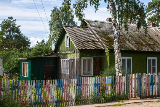A typical residential wooden house in settlement of city type in Leningrad region, Russia.