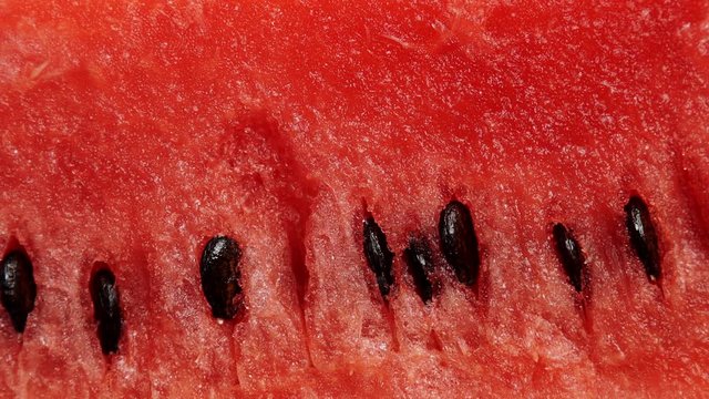 Closeup of fresh red watermelon fruit as background. Healthy food organic nutrition. Dolly slider shot 4K ProRes HQ codec