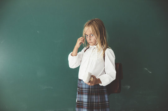 Portrait of girl standing in classroom