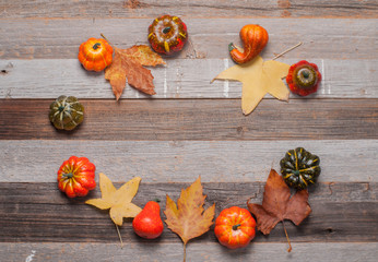 Pumpkins on wooden background. Halloween, Thanksgiving day or seasonal autumnal.