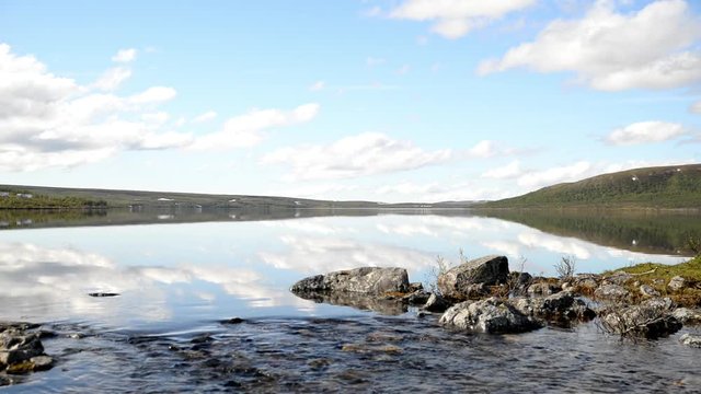 Quiet large lake with reflections