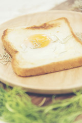 Breakfast consists of fried bread egg and vegetables.