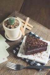 Chocolate cake Placed on an old wooden desk