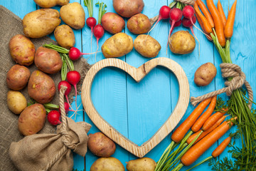 Big set of fresh vegetables on a blue backgroundon