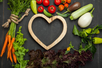 Big set organic food. Fresh raw vegetables. On a black chalkboard.