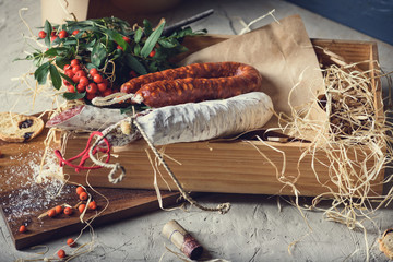Fuet - salami. Meat snack in a box.Various smoked sausages.
