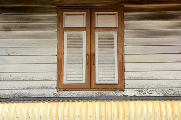 white window at antique wood house