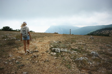 Fototapeta premium Girl hiking in mountains