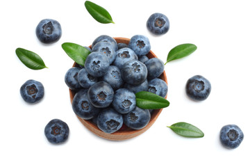 blueberries in wooden bowl isolated on white background. top view