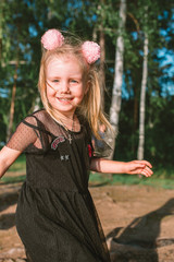 Portrait of child girl with blonde hair and blue eyes 