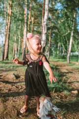 Portrait of child girl with blonde hair and blue eyes 
