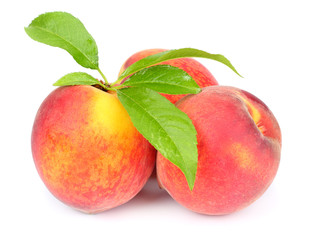 Peach. Fruit with green leaf isolated on white background