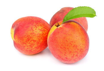 Peach. Fruit with green leaf isolated on white background