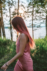 Portrait of stylish pink hair girl in the forest