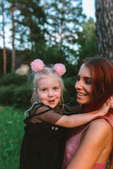 Young mother and daughter together having joyful moment of being together