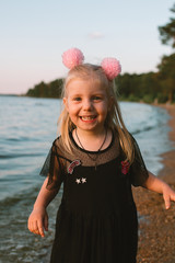 Portrait of child girl with blonde hair and blue eyes 