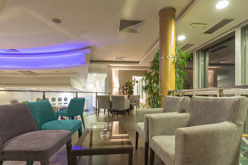Hotel lobby cafe interior in the evening