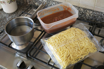 cooking egg pasta at tomato sauce