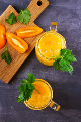 Bloody mary cocktail made with yellow tomatoes. View from above, top studio shot, vertical