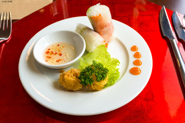 Vietnamese style rice paper springrolls with deep fried fishballs