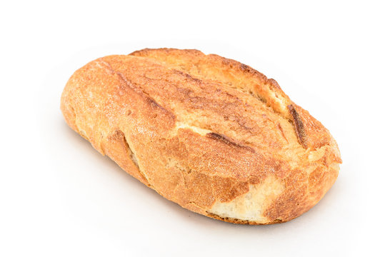 Closeup Of A Whole Sourdough Bread Isolated On White Background.