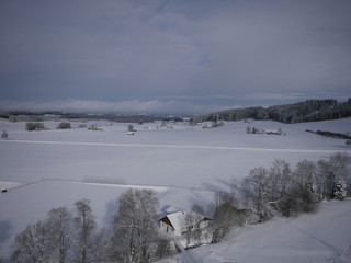 aerial photo of village in winter