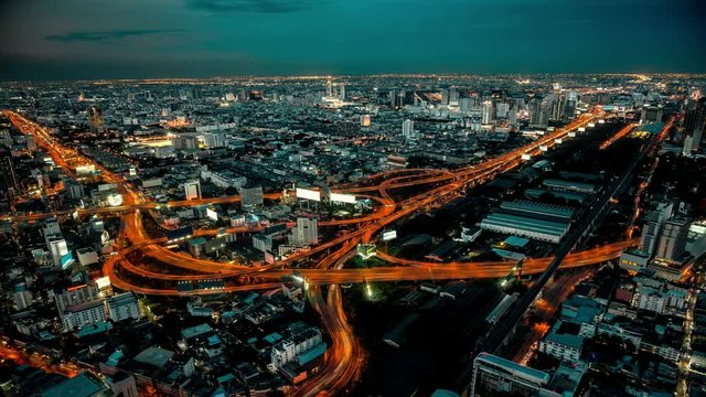 Cinemagraph 4K resolution, Cityscape Bangkok downtown at night, from the top of view on skyscraper, show lighting on the road of communication concept. Abstract background with HRD effect filter.