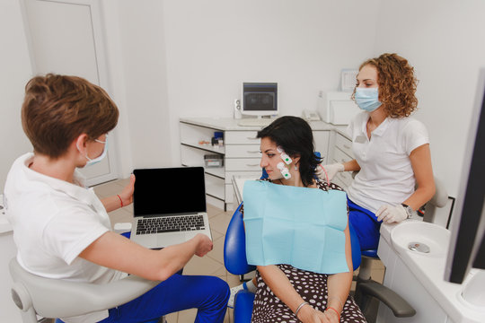 Setting and determining bite and position of jaws with the help of a device with a neuromuscular stimulator. Myo-monitor in the dentist's office. Transcutaneous electrical nerve stimulation.